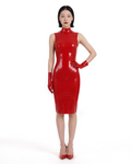 A model shown from the front wearing the high-shine red latex The Arbiter Dress by Ribcage Latex, featuring a flawlessly sculpted second-skin fit and effortless authority.