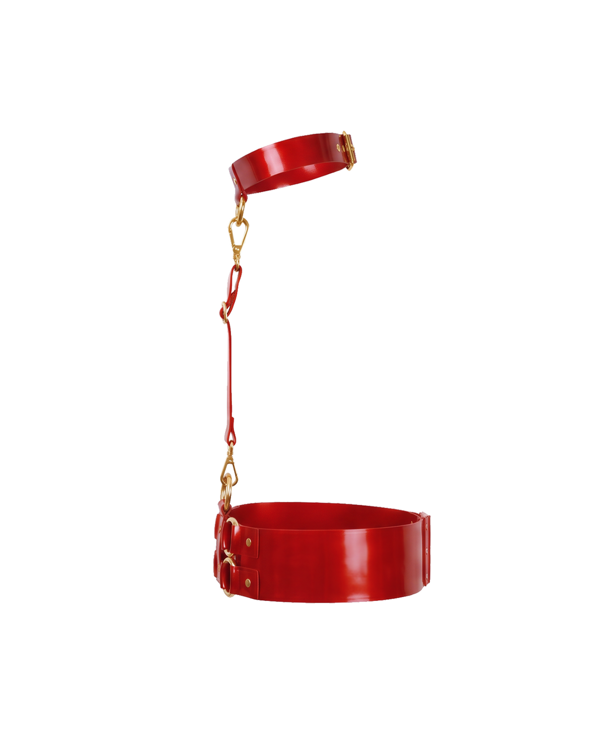 A side profile view of the red latex harness set by Ribcage, showing the structural connection of the choker, chest strap, and waist belt with gold metallic hardware, displayed on a clean white background.