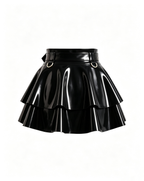 A glossy black latex peplum overlay belt by Ribcage, featuring a structured waist belt with a gold metallic buckle, hardware rings, and a double-layer flounce peplum.