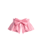 A front view of the high-shine metallic pink latex peplum overlay by Ribcage, featuring a dramatic oversized structural bow at the front and a flared, softly pleated drape.