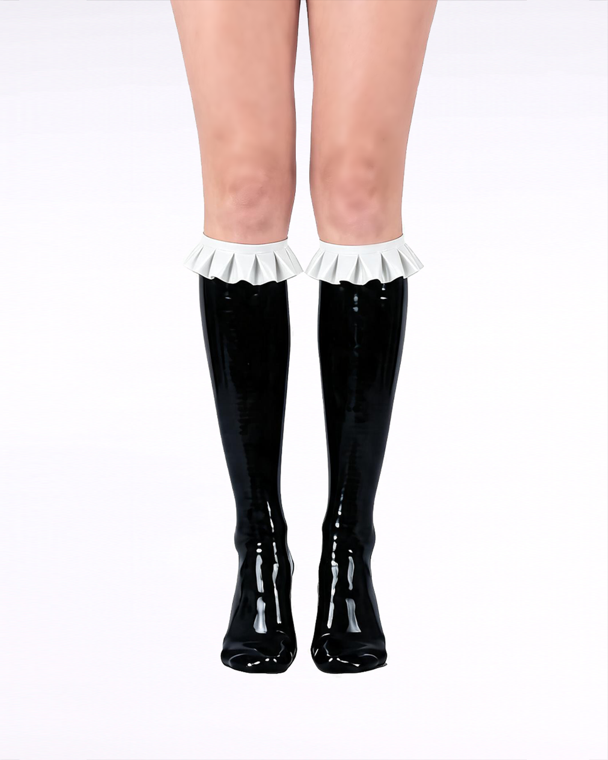 A front view of a model's legs wearing high-shine black latex knee-high socks by Ribcage, featuring contrasting white ruffled trims at the cuffs and a seamless, second-skin fit.