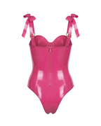 A vivid fuchsia latex bodysuit by Ribcage, featuring a sweetheart neckline with a center bow, structured bow shoulder straps, and a high-cut leg silhouette.