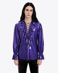 A model shown from the front wearing the high-shine metallic purple latex Phantom Ruffled Lace-up Blouse by Ribcage, featuring an intricate front lace-up closure framed by voluminous ruffled trims.