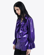 A side view of a model wearing the high-shine metallic purple latex Phantom Ruffled Lace-up Blouse by Ribcage, highlighting the fluid drape, long gathered sleeves, and elasticized ruffled cuffs.