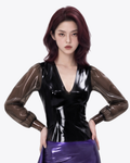 A model shown from the front wearing the high-shine black latex Ripple Blouse by Ribcage, highlighting the deep V-neckline and semi-transparent smoky balloon sleeves.