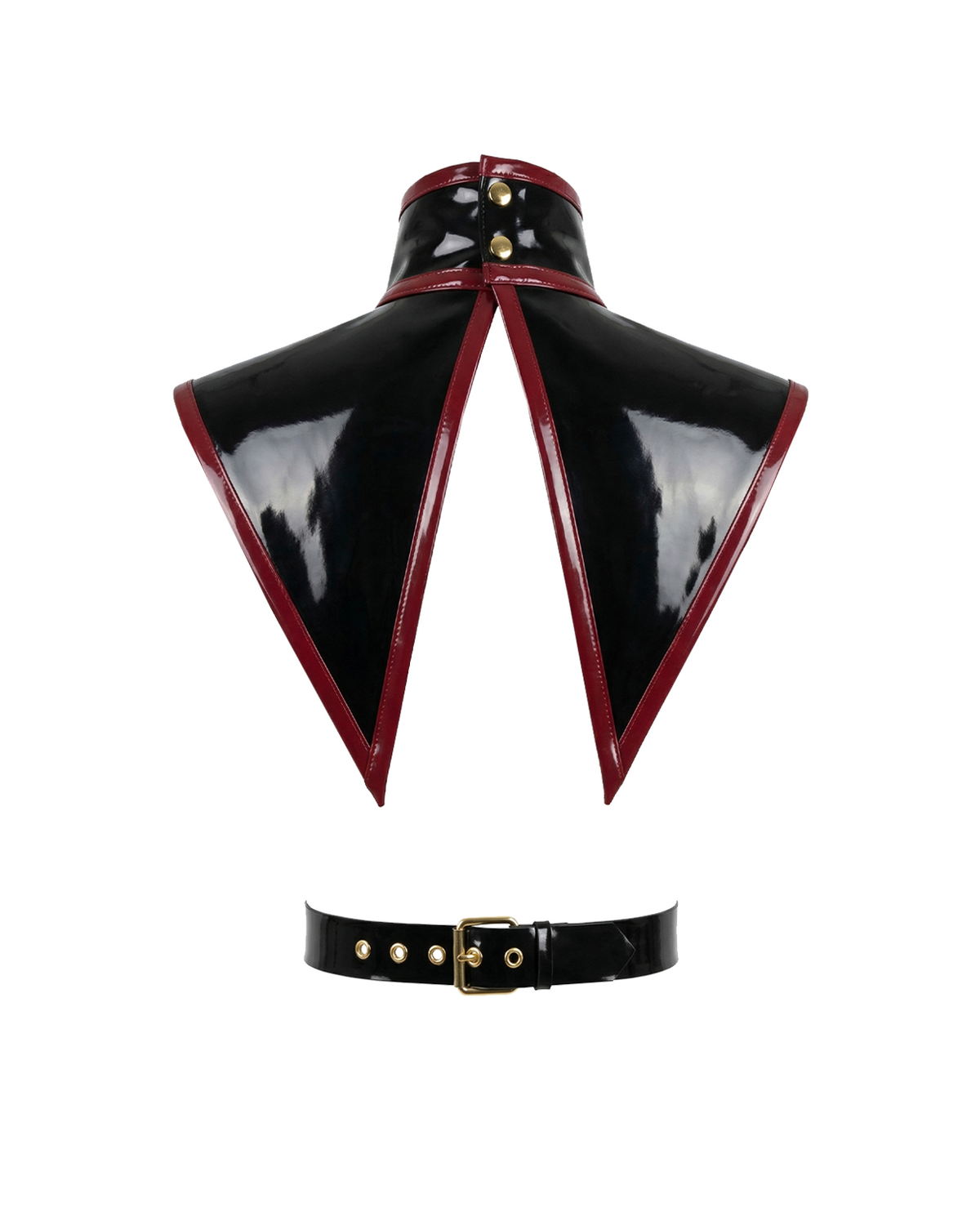 A glossy black latex modular capelet harness set by Ribcage, featuring a high-neck triangular capelet with contrast red trim, a vertical chest strap, and a waist belt with metallic O-rings.