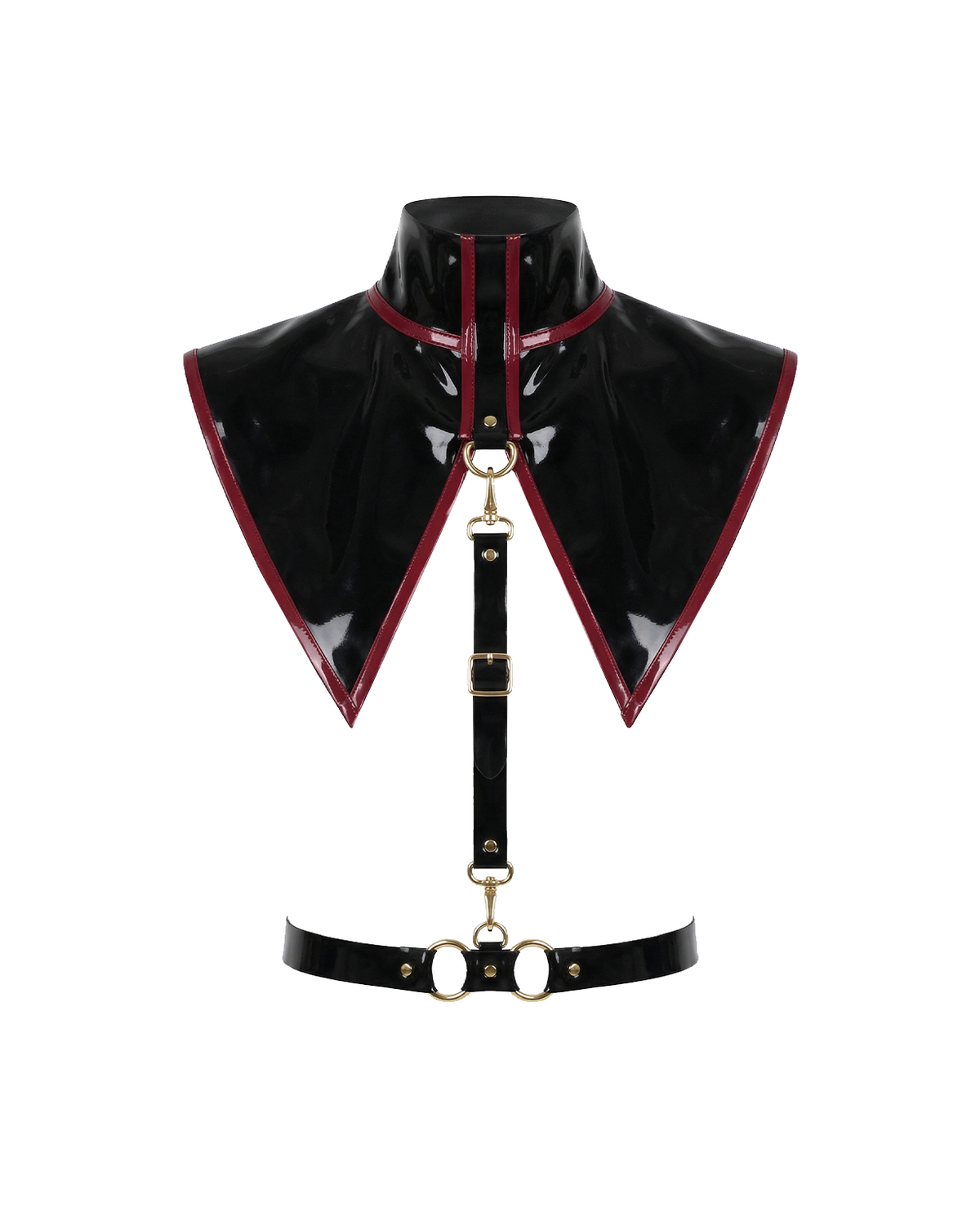 A glossy black latex modular capelet harness set by Ribcage, featuring a high-neck triangular capelet with contrast red trim, a vertical chest strap, and a waist belt with metallic O-rings.